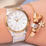 Kit Relógio Feminino Champion Original Bicolor Luxo + Pulseira Berloques Modelo Analógico com Pulseira em Aço inoxidável com Detalhes Prata e Dourado CN29409S Presente Perfeito Namorados Mães Esposa