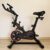 Bicicleta Ergométrica Fitness para Cardio e Musculação com base Cor Preto e Vermelho Epsilon Marca Redfin 8kg Inercia